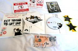 Banksy Sortie par la boutique de souvenirs DVD ÉDITION LIMITÉE CARTES POSTALES AUTOCOLLANTS LUNETTES